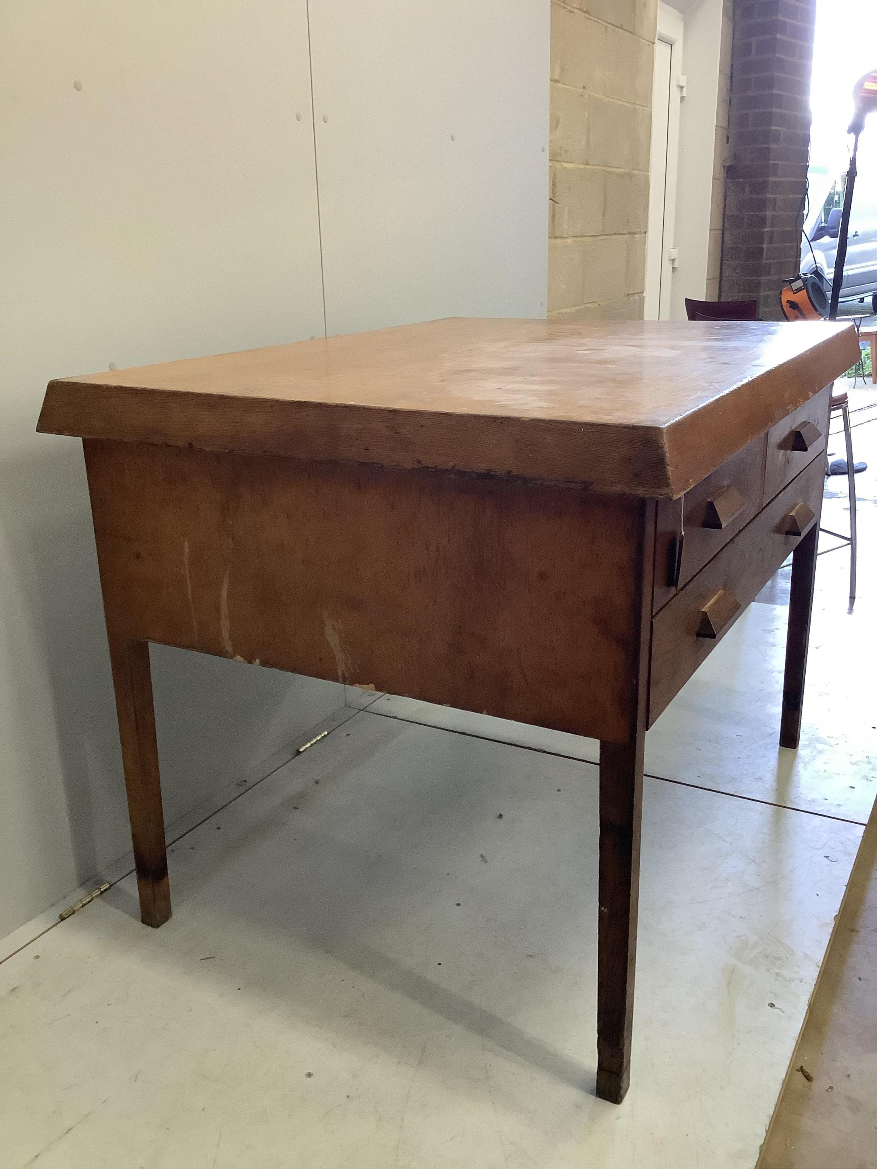 An early 20th century Scandinavian oak three drawer plan chest, width 125cm, depth 94cm, height 92cm. Condition - fair